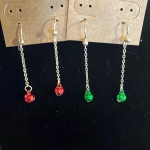 Twin style Christmas earrings jingle bells.
